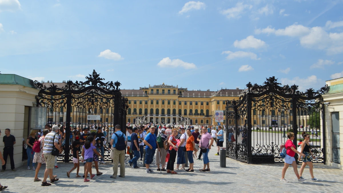 Crowd at the entrance gate of Schonbrunn Palace waiting to enter.