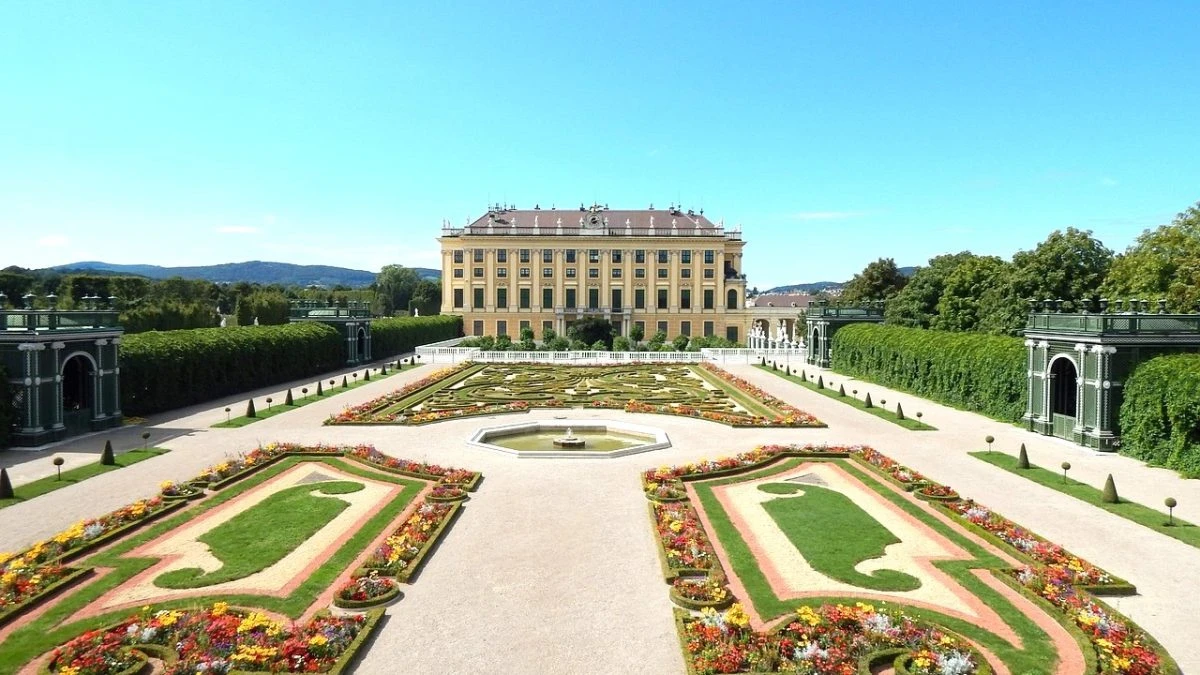 Front view of Schönbrunn Palace Vienna, with vibrant baroque flower gardens